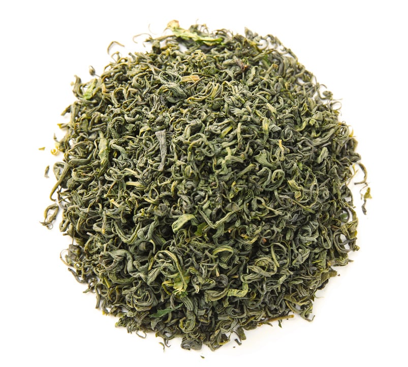 Dried Green Tea Leaves Isolated on White Background  